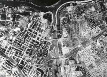 A black and white aerial image of the Earth.