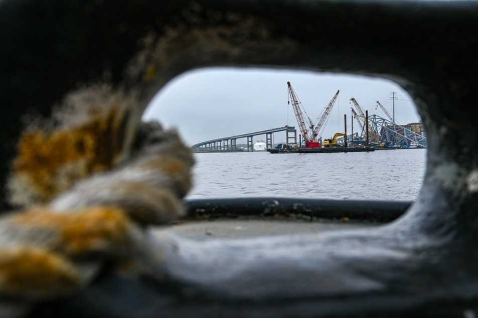 Image of the crane performing clean up of the bridge